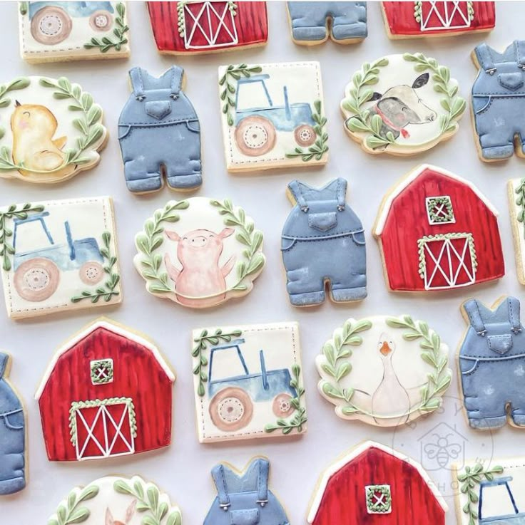 decorated cookies with farm animals and tractors on them are arranged in rows next to each other