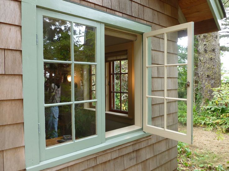 an open window on the side of a house