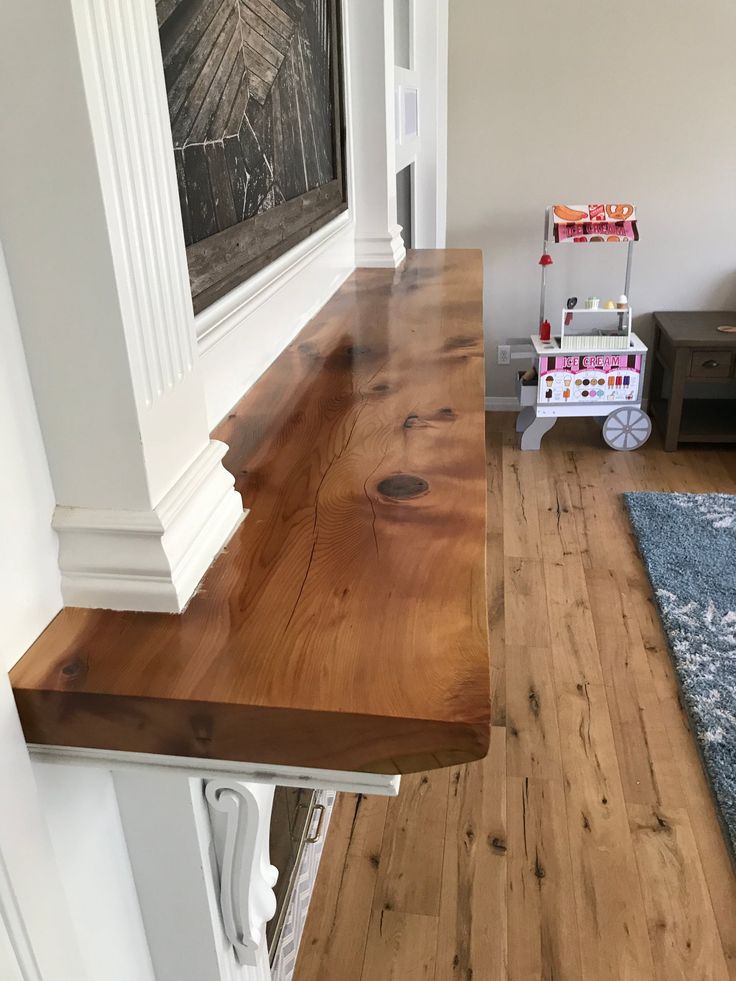 a wooden counter top sitting in the middle of a room