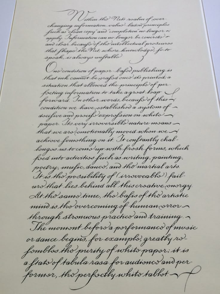 an old letter with cursive writing in black ink on a white sheet of paper