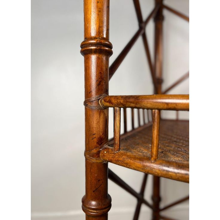 an old wooden chair with wood slats on the back