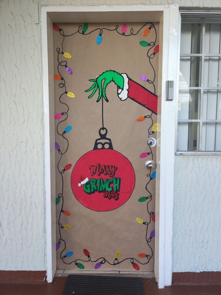 a door decorated with christmas decorations and the words happy grin on it's side