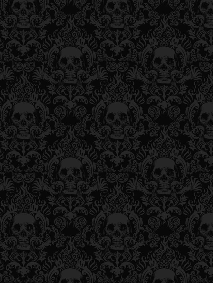 a black and white wallpaper with skulls on it