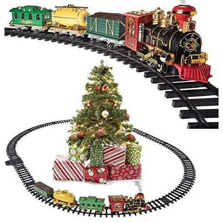 a christmas tree and train set with presents on the tracks in front of it, as well as an ornament