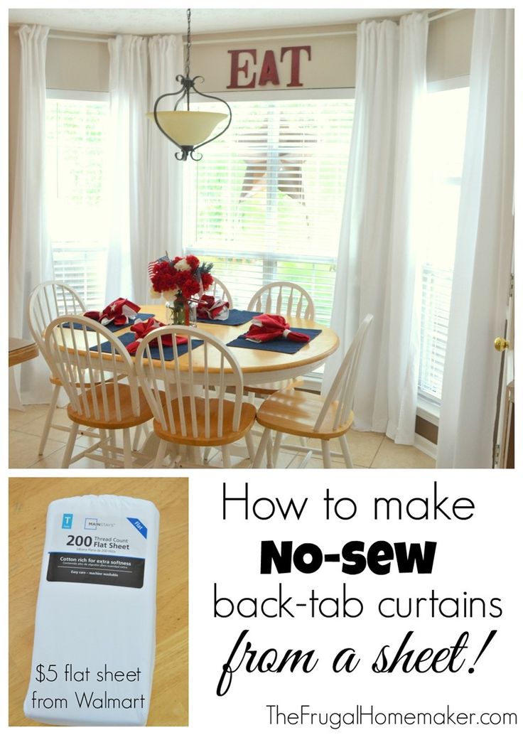 the dining room table is set for four with white chairs and red flowers on it