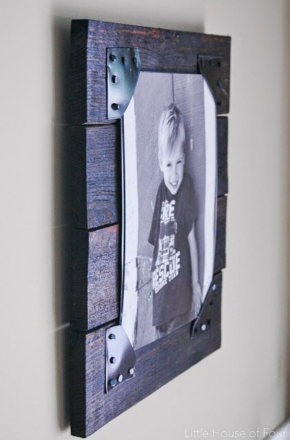 a wooden frame with a photo hanging on it