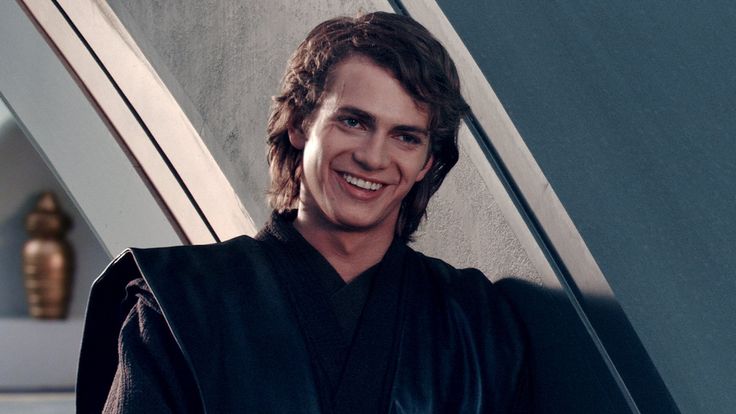 a young man with long hair wearing a star wars costume and looking at the camera