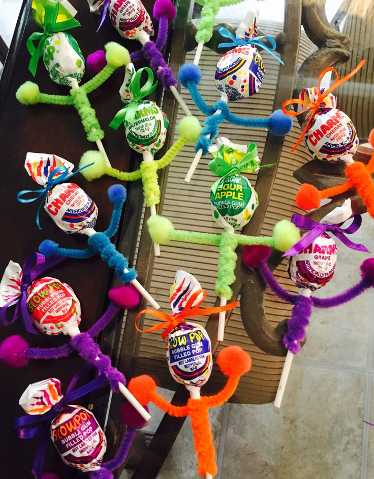 candy lollipops are lined up on a table