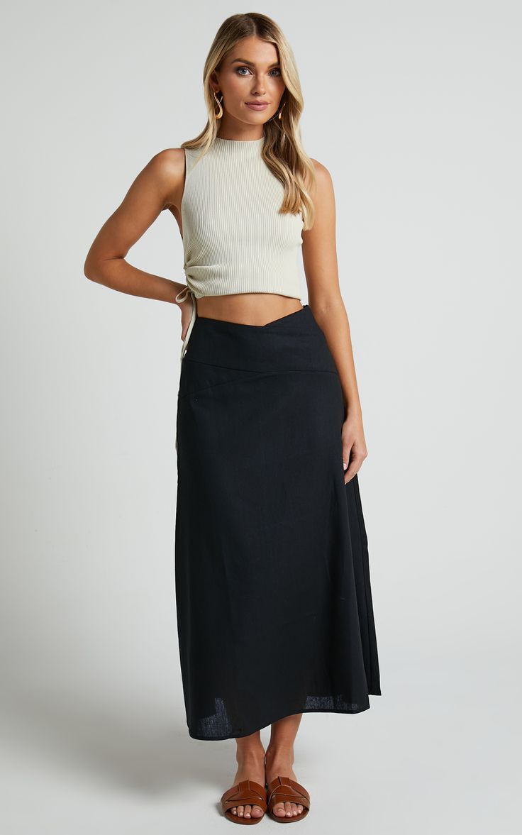 Get ready to turn heads in this flirty and playful Sundry Midi Skirt! With its linen look fabric and high-waisted design, this A-line skirt is perfect for casual days out or dressed up for a night on the town. The cross-front detail adds a touch of sassiness to your outfit, while the black color ensures versatility. Whether you pair it with a crop top or a cozy sweater, this midi skirt is sure to become your new go-to piece for effortless style. So why wait? Embrace your inner fashionista and st Elegant Pleated Maxi Skirt For Vacation, Aline Skirt Outfit, Tunic Tops Outfit, Black Linen Skirt, Skirt Outfit Summer, Tops Outfit, I Have Nothing To Wear, Aline Skirt, Hoi An