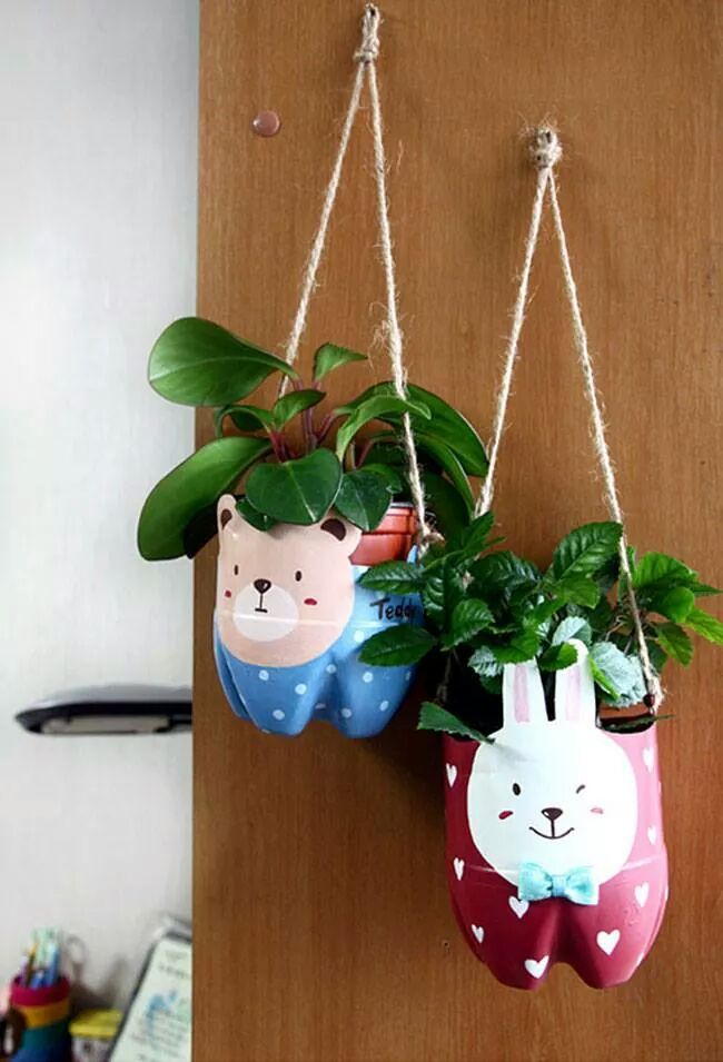 two hanging planters with plants in them