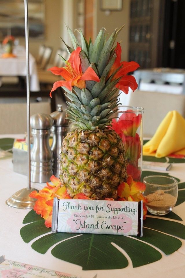 a pineapple sits on top of a table