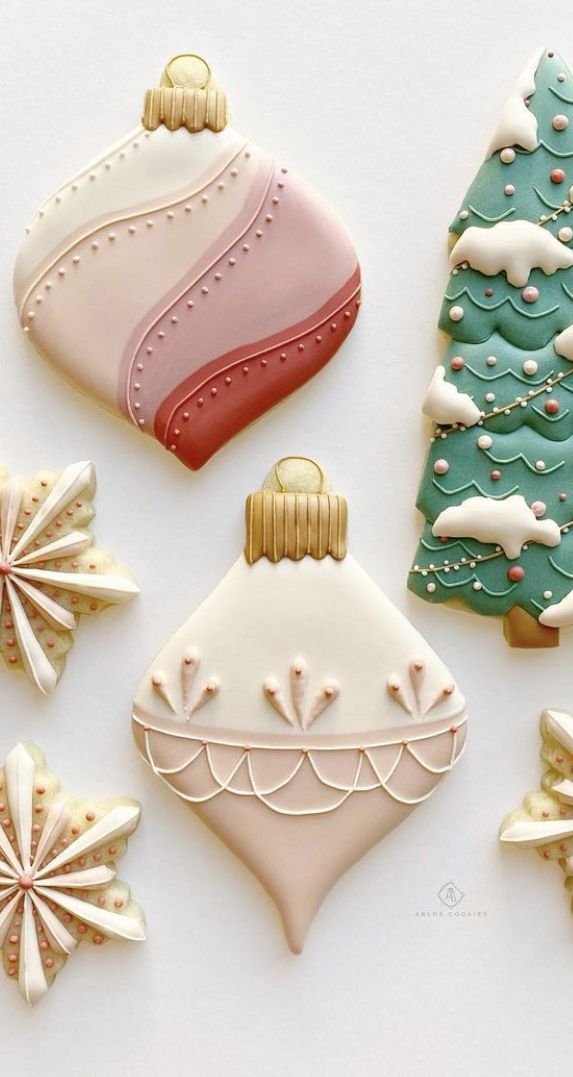 decorated christmas cookies on a white surface