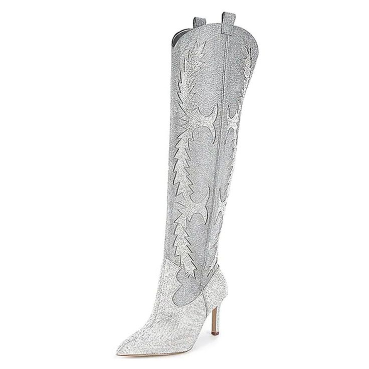 a pair of white high heel boots