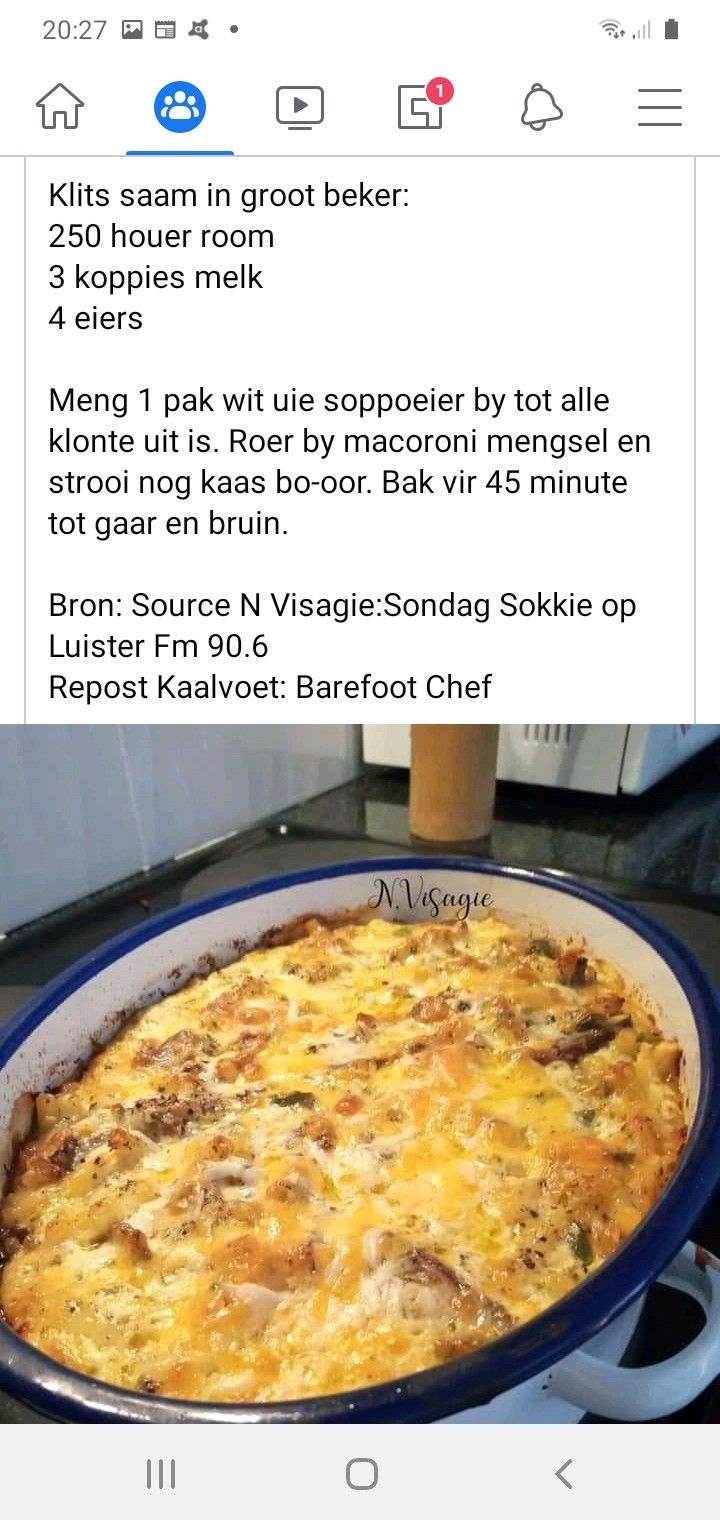 an image of a large casserole in a blue dish on a stove top