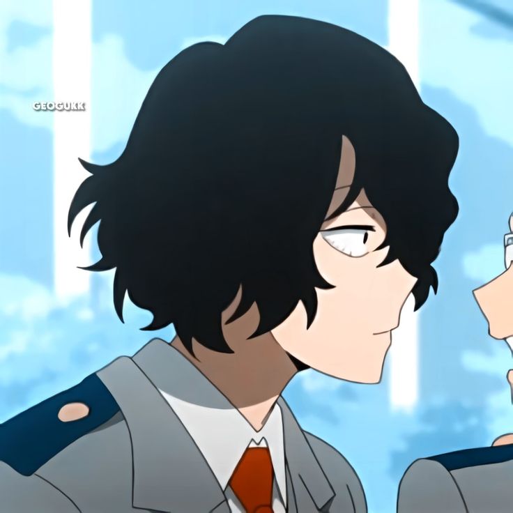 two anime characters one is wearing a suit and the other is looking at something in his hand