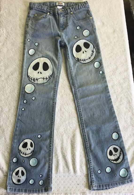 a pair of jeans with skulls painted on them