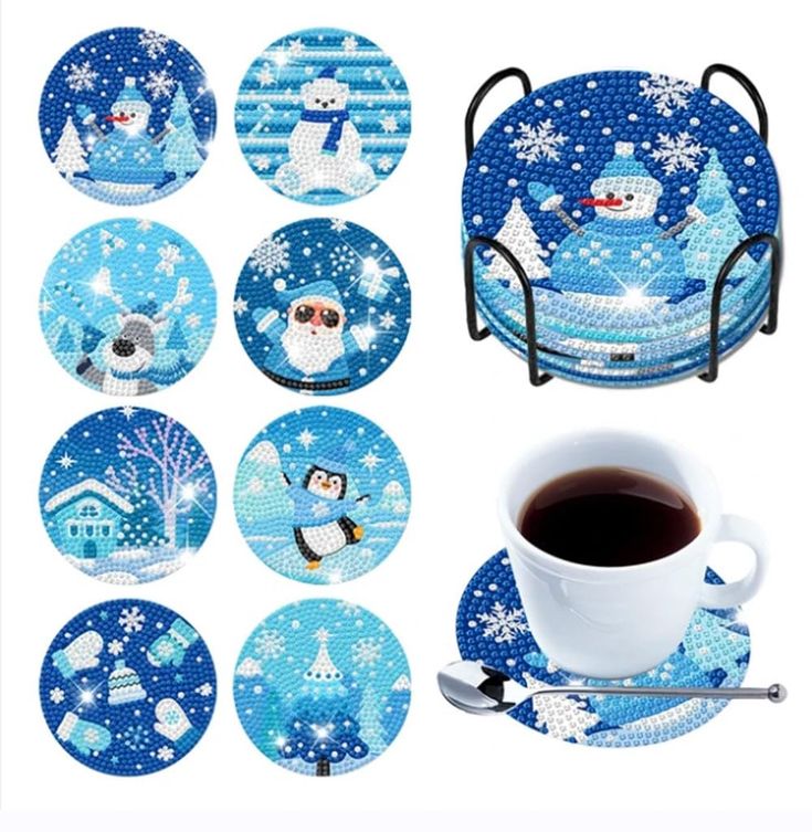 a cup of coffee sitting next to some plates and coasters with snowmen on them