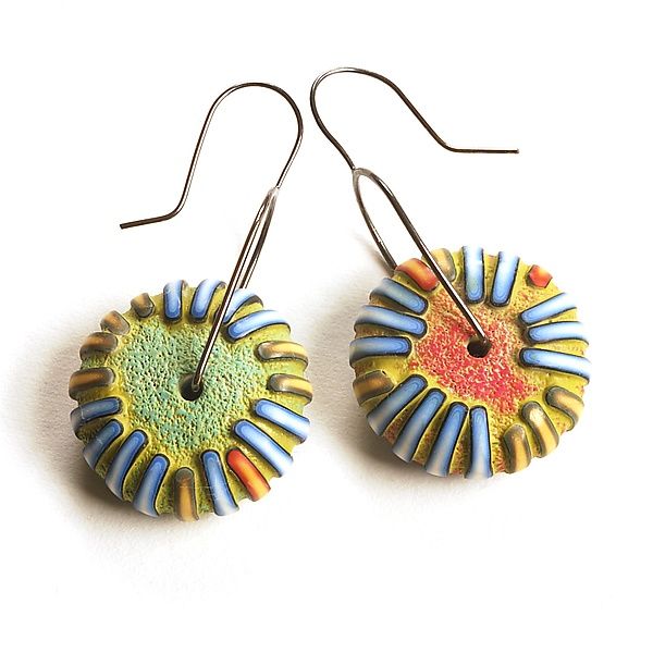 two pairs of earrings with colorful designs on them