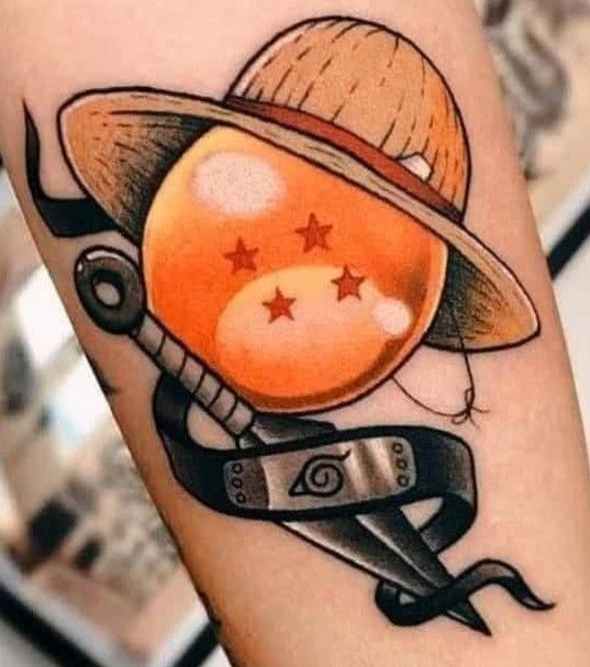 a tattoo with scissors and an orange ball on it