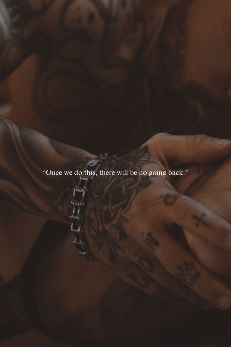 a man with tattoos on his arm holding a cell phone in his hand and the words, once we do this, there will be no point back