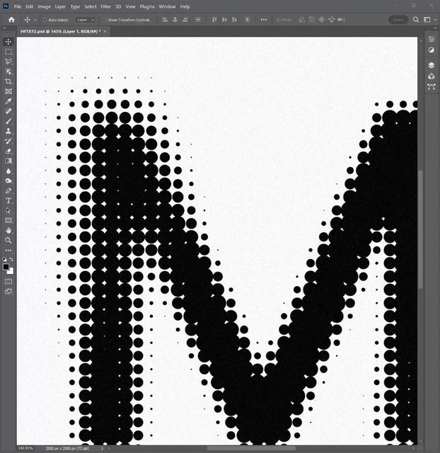 the letter m is made up of black and white dots