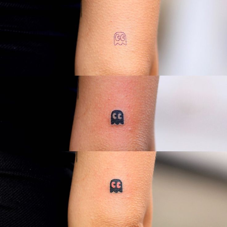 two small tattoos on the arm of a woman