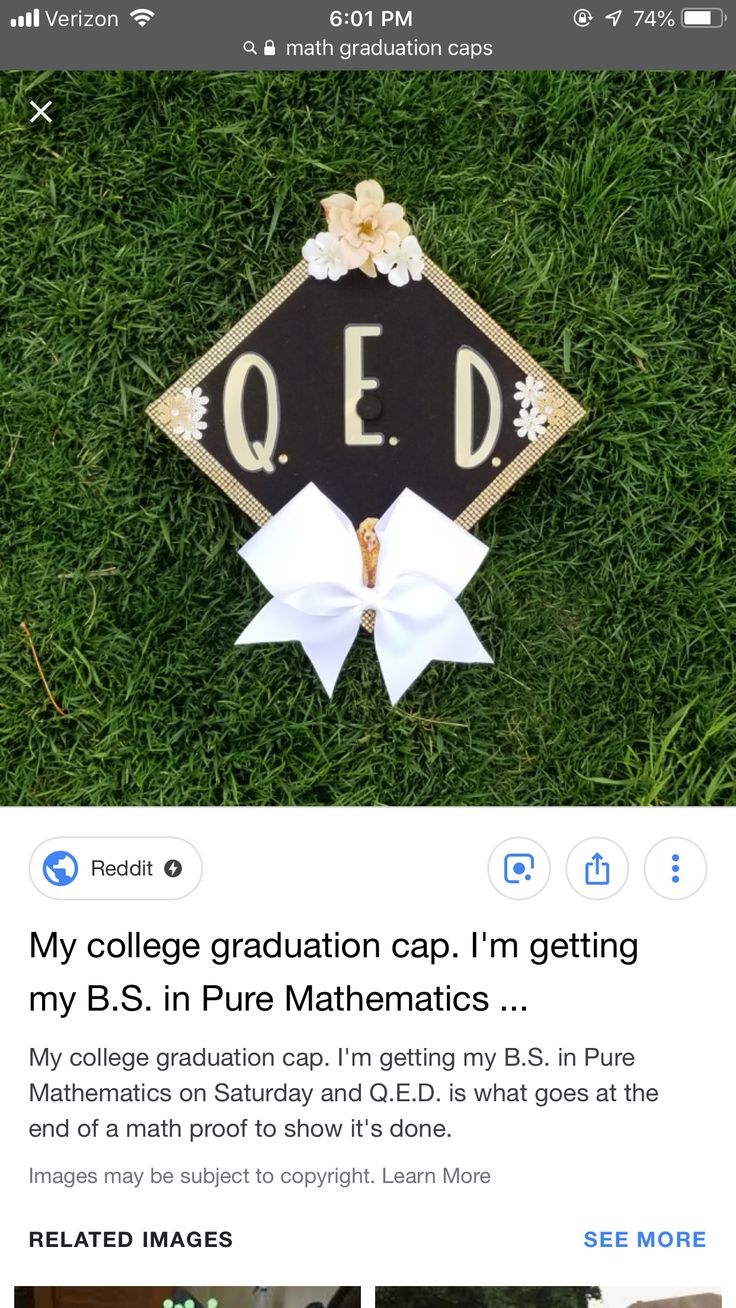 the college graduation cap is on top of some green grass with flowers and ribbons around it