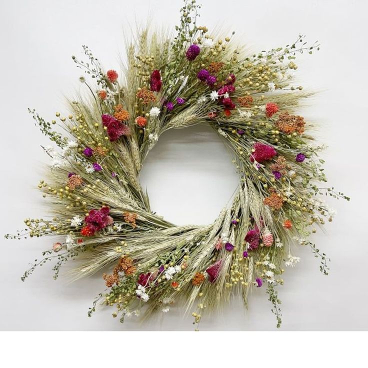 a wreath with dried flowers on it