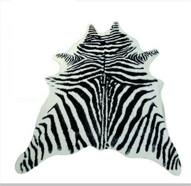 a zebra print area rug with black and white stripes on the bottom, in front of a white background