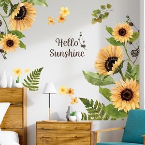 a bedroom with sunflowers painted on the wall and a blue chair in front