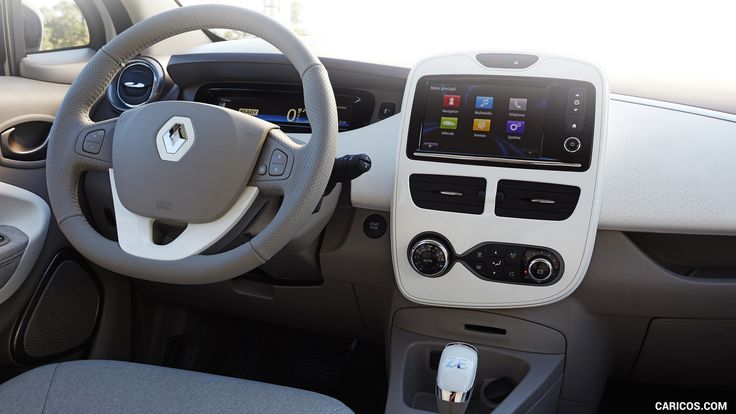 the interior of a small car with electronic controls