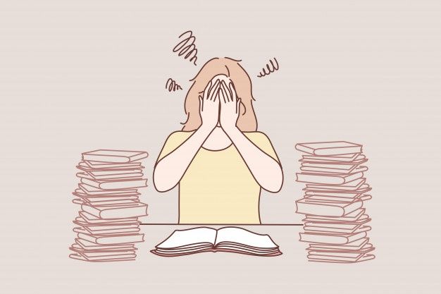 a person sitting at a table with stacks of books in front of her and covering their eyes