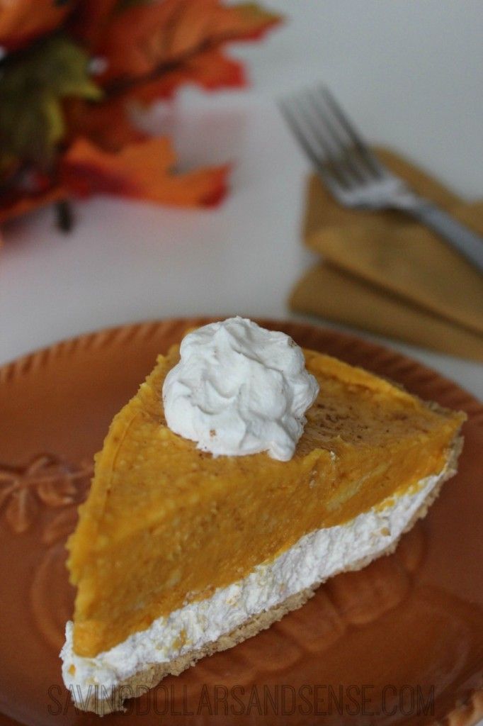 a slice of pumpkin pie with whipped cream on top