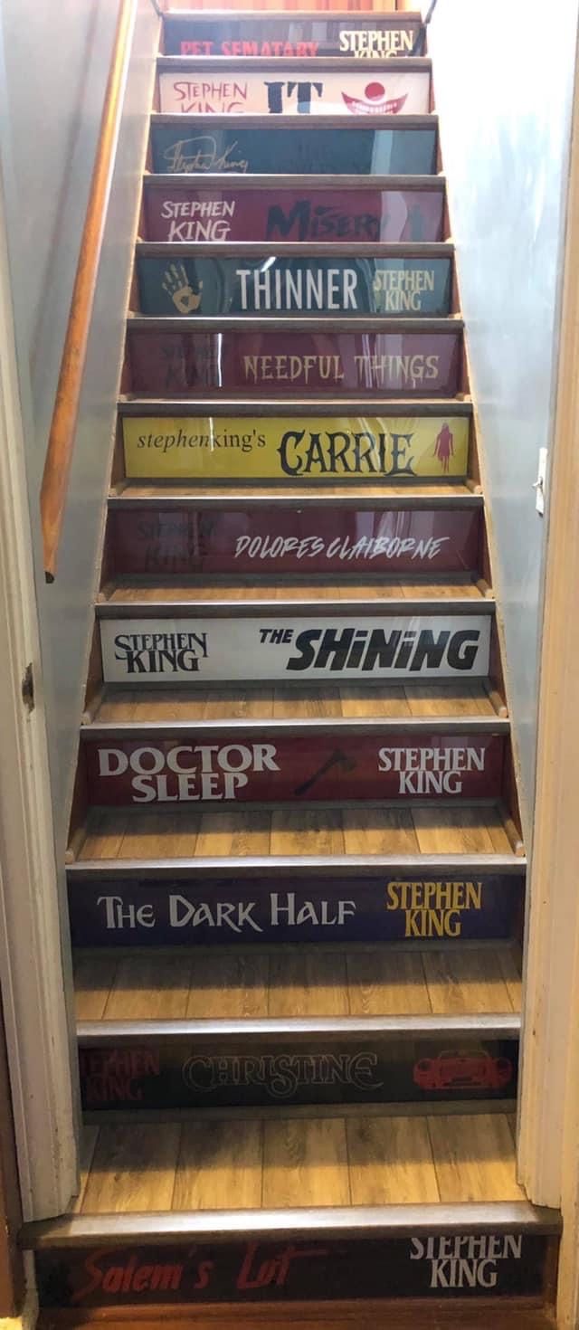 a set of stairs that have been painted with various movie titles on them and the words shining in different languages