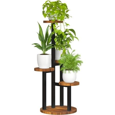 three tiered plant stand with potted plants