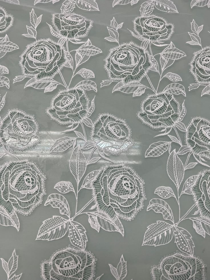 white lace with roses on grey background