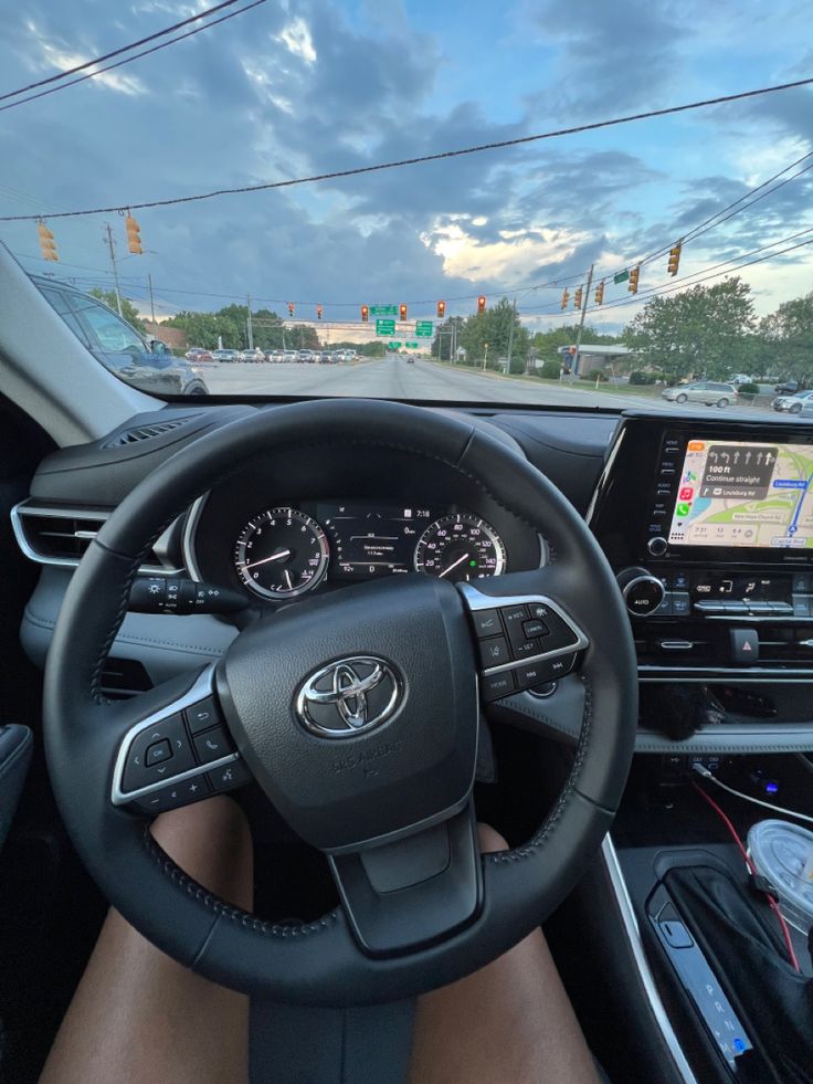 the interior of a car with dashboard, steering wheel and electronic display on the screen