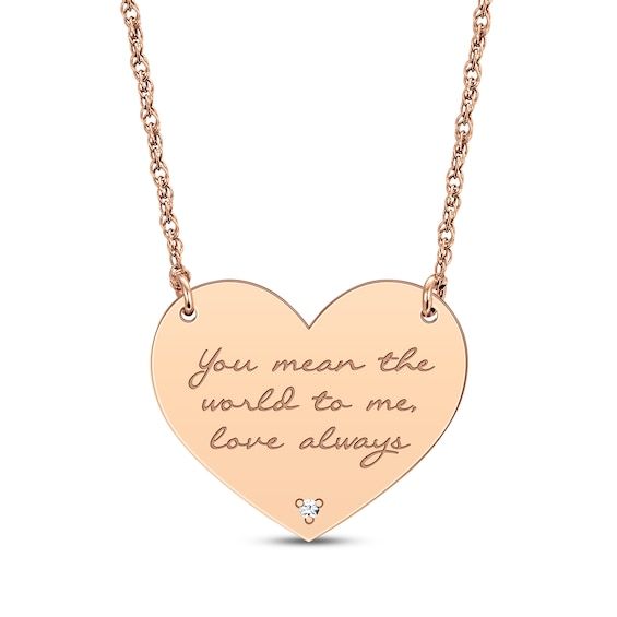 Reveal your love language with this romantic heart necklace. Your sentiment is conveyed on a heart-shaped pendant. A single round-cut diamond accent lends sparkle to the base of the design. Crafted in 14K rose gold, the pendant suspends centered on an 18-inch rope chain that secures with a spring ring clasp and is adjustable from 16 to 18 inches. Rose Gold Heart Necklace For Valentine's Anniversary, Rose Gold Engraved Heart Necklace For Anniversary, Rose Gold Diamond Heart Necklace With Charm, Engraved Rose Gold Heart Necklace For Valentine's Day, Personalized Rose Gold Heart-cut Necklace, Personalized Rose Gold Heart Cut Necklace, Valentine's Day Rose Gold Diamond Necklace, Rose Gold Diamond Necklaces For Valentine's Day, Rose Gold Diamond Heart Pendant Necklace