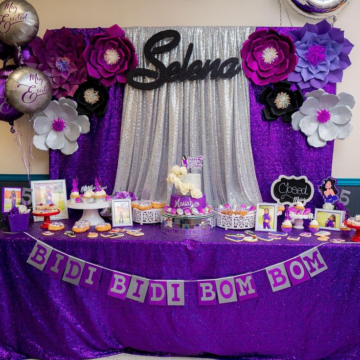 a purple and silver birthday party with balloons