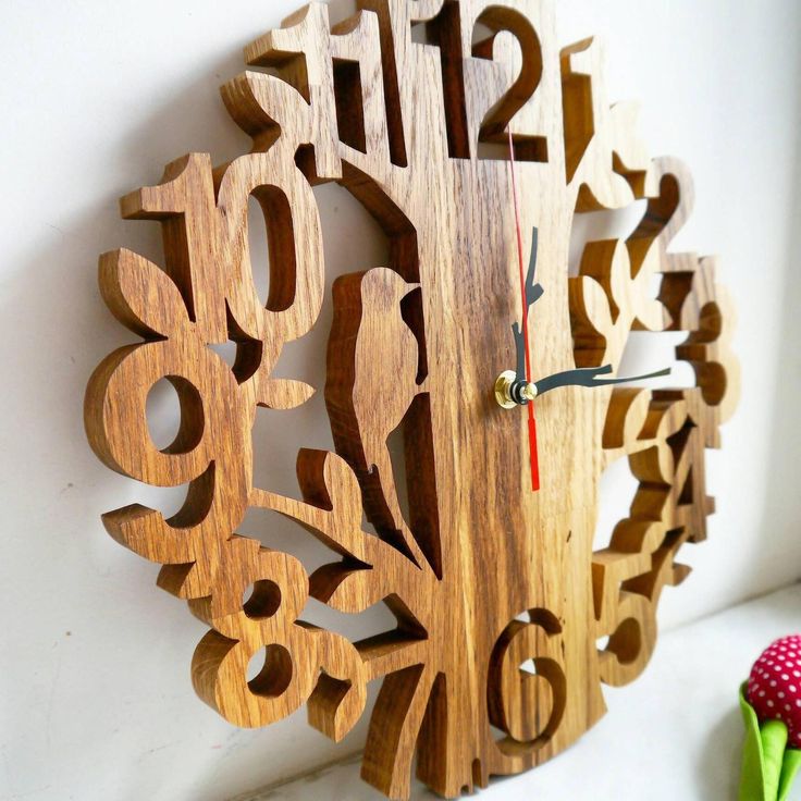 a wooden clock that has numbers on it