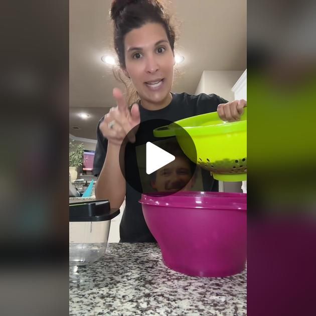 a woman is mixing food in a pink bowl