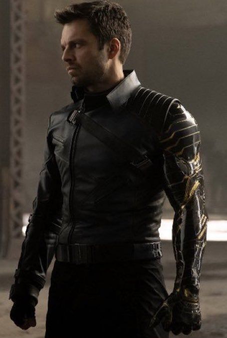 a man in black leather and gold armor