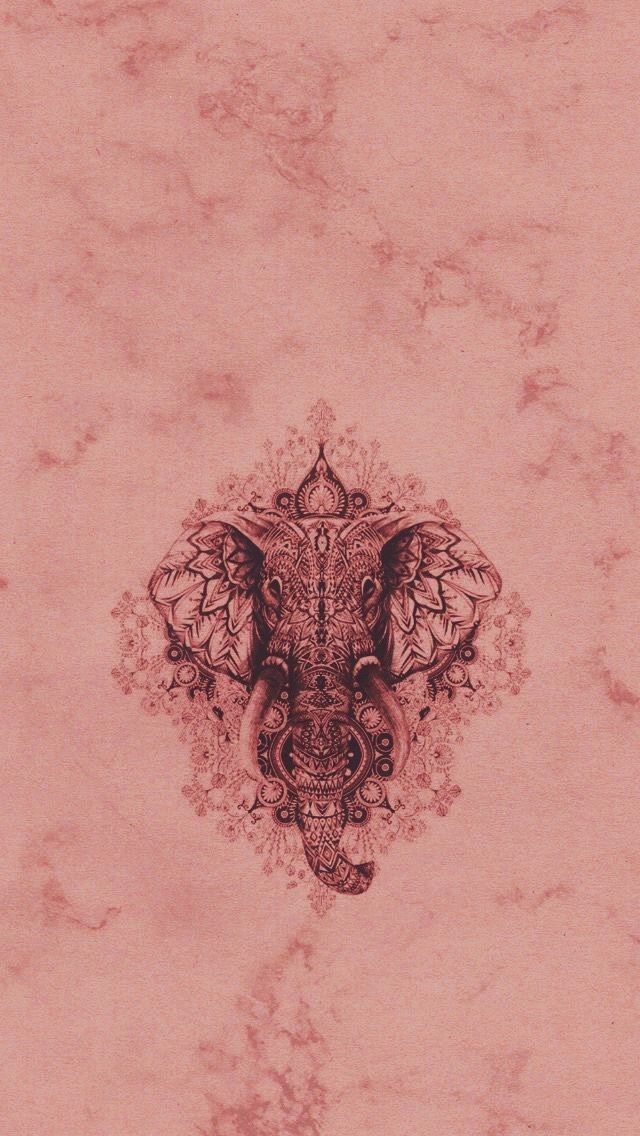 an elephant with intricate designs on it's face is shown against a pink background