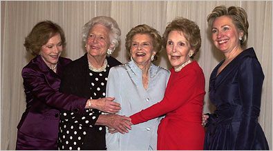 the women are posing for a photo together