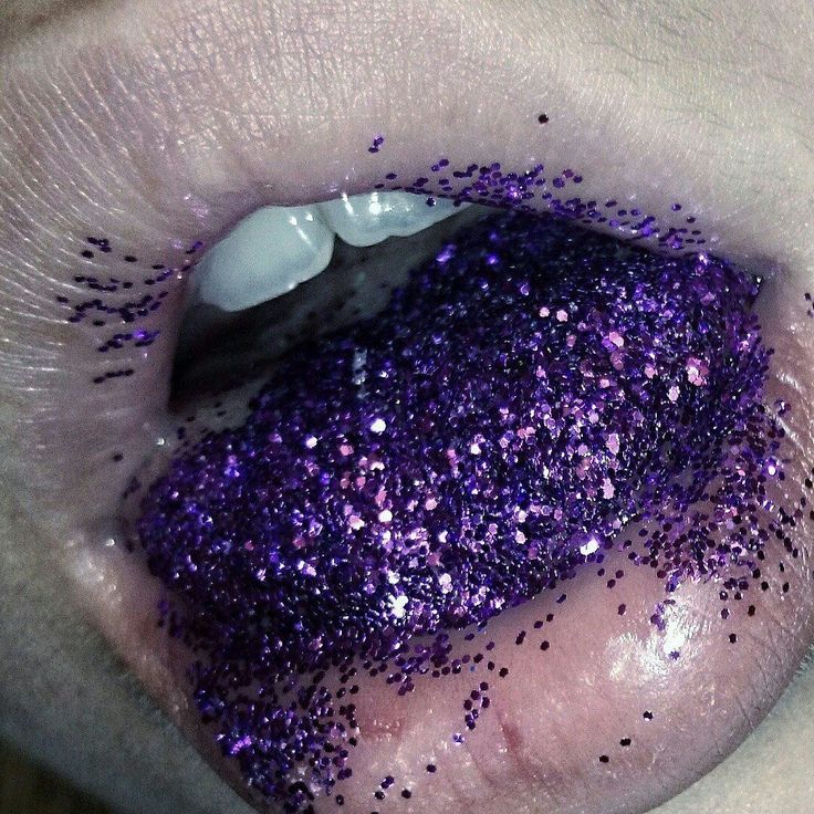 a person with purple glitter on their lips