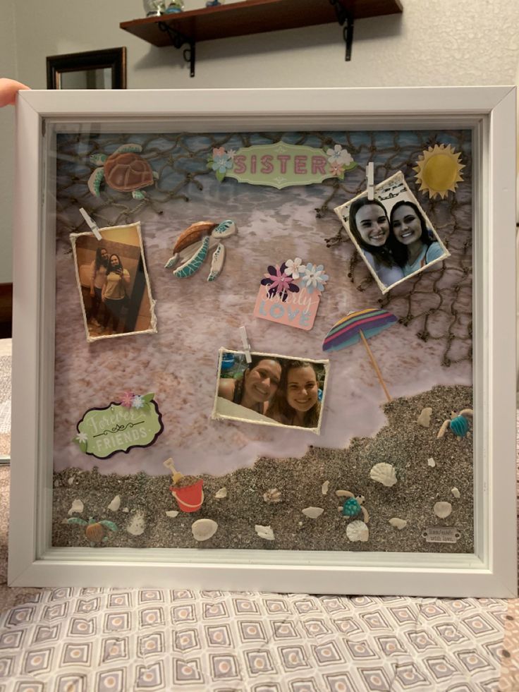 a white frame with pictures and magnets on it