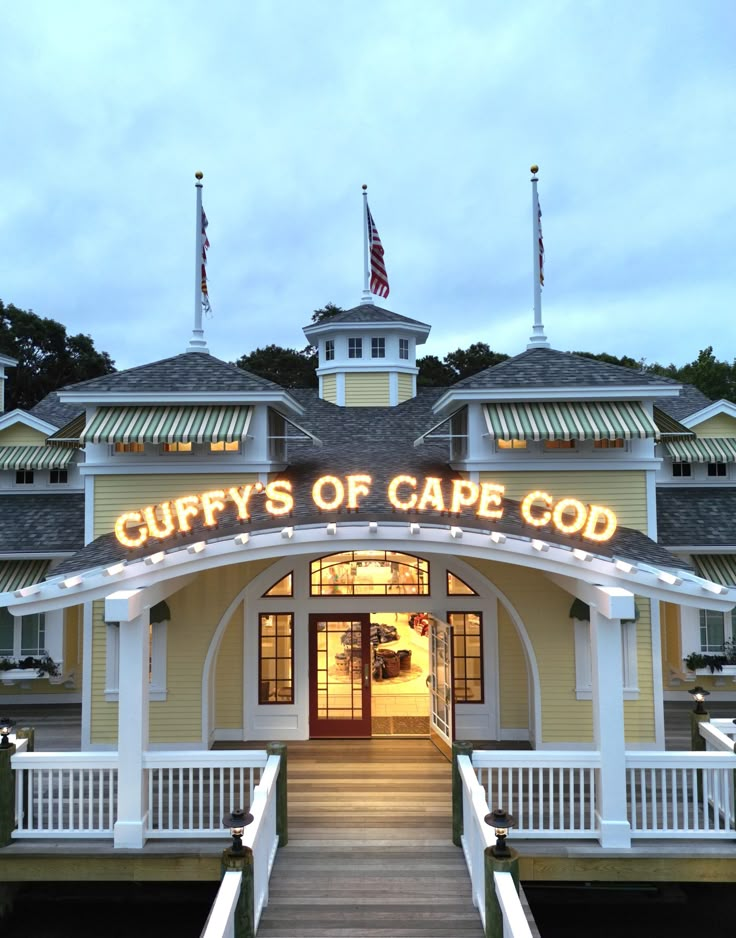 the front entrance to curly's of cape good at dusk, with lights on