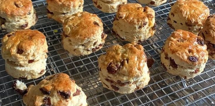 many different types of pastries on a cooling rack