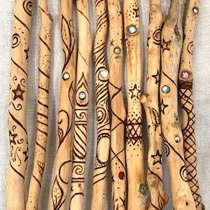 several wooden sticks with designs on them