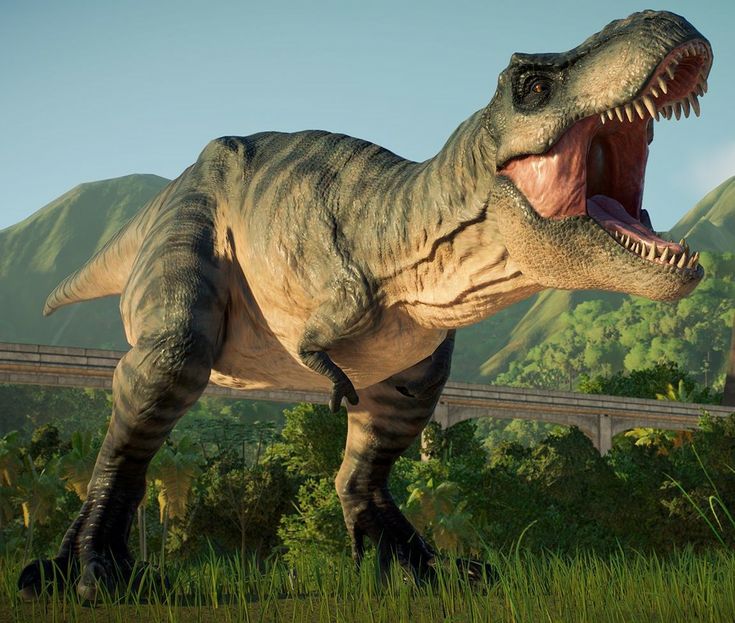 a dinosaur with its mouth open standing in the grass